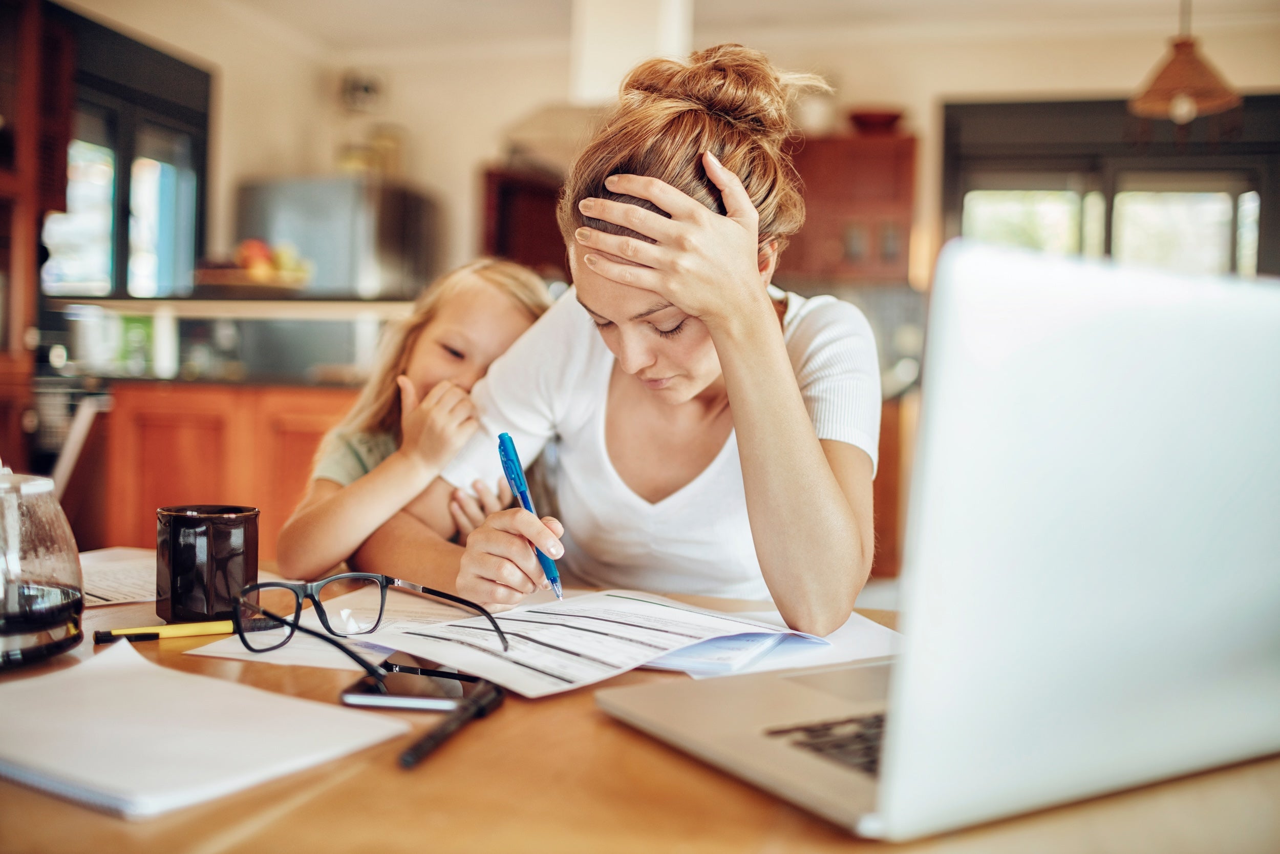 Stressed out mother, paying bills